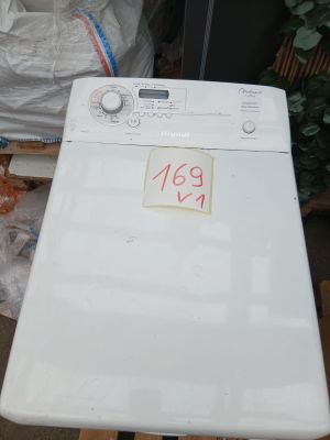 an image of a washing machine sitting on top of a table