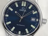 a close up of a watch on a white surface