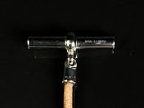 an image of a hammer with a wooden handle on a black background