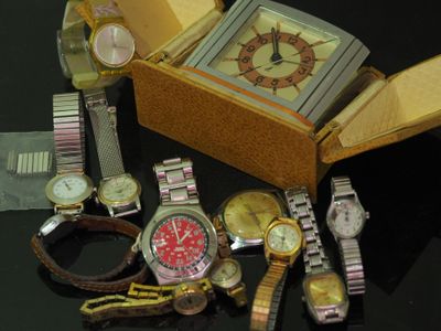 a lot of watches that are sitting on a table