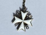 an image of a silver and white star shaped pendant on a chain