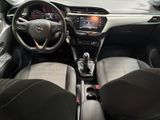 the interior of a small car with a steering wheel and dashboard