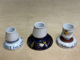 three cups that are sitting on a table