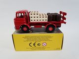 a red toy truck with a crate on the back of it