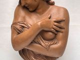 statue of a woman holding a baby in her arms