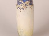 an image of a vase with blue flowers on it