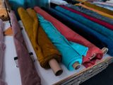 many different colored umbrellas sitting on a table