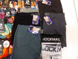many different types of men ' s underwear laid out on the floor