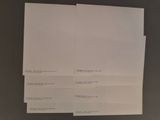 three pieces of paper on top of each other