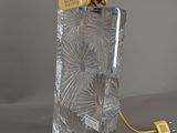 an image of a glass lamp with a cord plugged into it