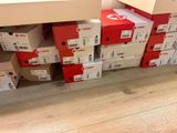 many boxes stacked on top of each other on the floor