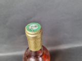 a bottle of wine that is sitting on a table