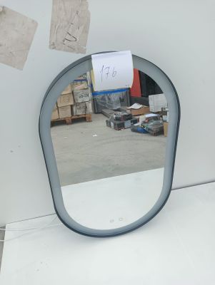 a mirror that is sitting on a table in a room