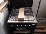 a stove that has a box on top of it