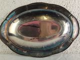 a silver plate with a mirror in the middle of it