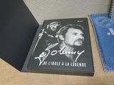 a book with a picture of a man on it next to a bag