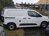 a white van that is parked in a parking lot