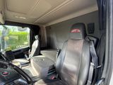 a view of the inside of a van with the driver ' s seat up