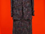 an image of a dress and coat on a mannequin stand