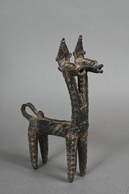 statue of a giraffe with two birds perched on its head