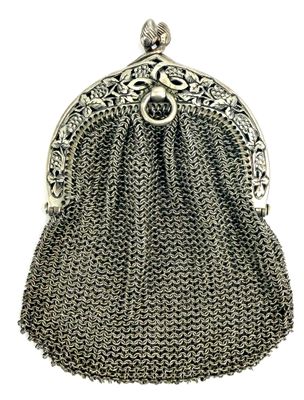a silver metal purse with a chain handle