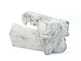 a stone object that looks like an elephant ' s head