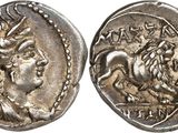 a silver coin with an image of a horse on it