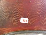 a close up of a red suitcase with a number on it