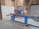 a picture of a machine that is cutting a piece of wood