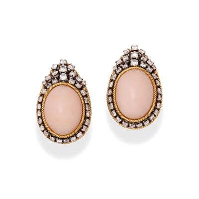 a pair of coral and diamond earrings