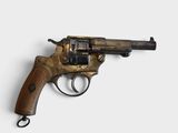 an old revolver with a wooden handle on a white surface