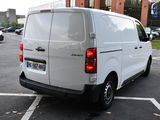 a white van that is parked in a parking lot