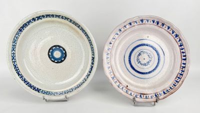 two plates that are sitting side by side on a table