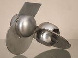 a metal object that is sitting on a glass table