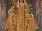 une peinture ancienne représentant une femme tenant un enfant dans ses bras