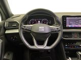 the interior of a car with a steering wheel, dashboard, and touch screen