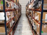 many boxes on the shelves in the warehouse