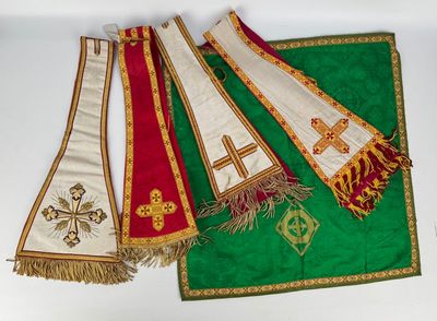 three green and red stoles with crosses and crosses on them