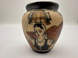 a vase with a picture of a woman on it