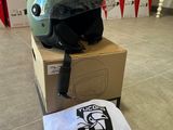a helmet sitting on top of a box on the floor