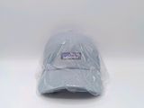 the hat is wrapped in plastic and sitting on a white surface