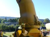 a large yellow machine that is sitting in the dirt