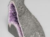 a rock with a purple stone inside of it
