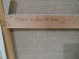a piece of wood that has writing on it