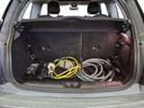 a trunk of a car with a bunch of wires in it