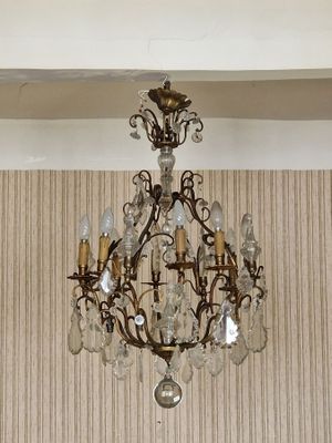 a chandelier hanging from the ceiling in a room