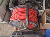 many different types of air compressors and hoses on the floor