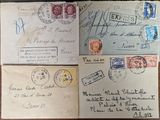 several old envelopes are sitting on top of a wooden table