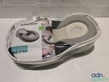 a bag with a pair of shoes in it on a table