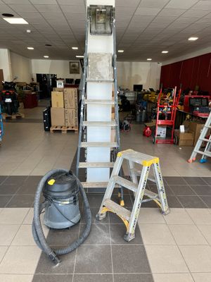 a picture of a room with a ladder and a vacuum in it